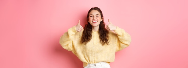 Smiling Girl Showing Thumbs Up in Approval