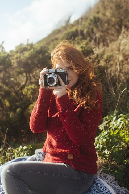 Girl On The Coast With A Vintage Camera