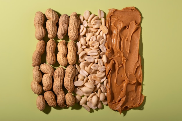 Top view peanuts on green background