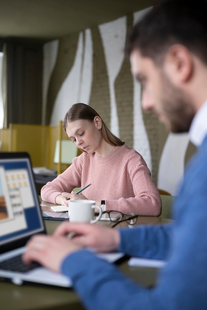 Blurry man working with laptop – Free Stock Photo