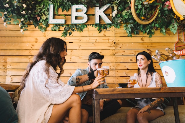 Group of three friends in restaurant