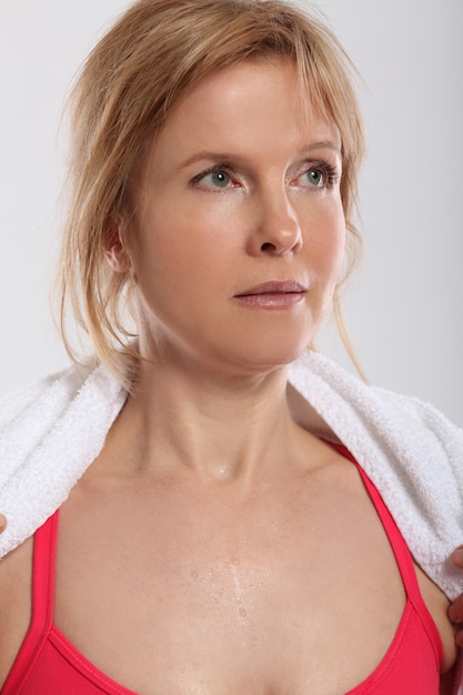 Woman Exercising with Dumbbells from Behind