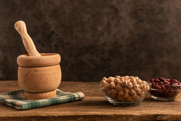 Mortar with Pestle and Assorted Ingredients on Table