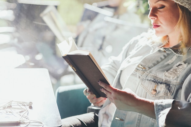 Woman resting with book in cafe – Free Stock Photo Download