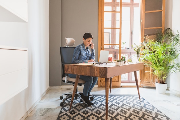 Businesswoman multitasking with phone