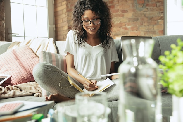 African American woman freelancer working in home office – Free Stock Photo Download