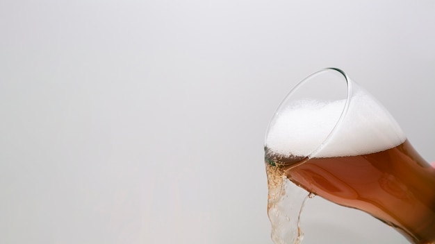 Glass of Beer Pouring with Copy Space