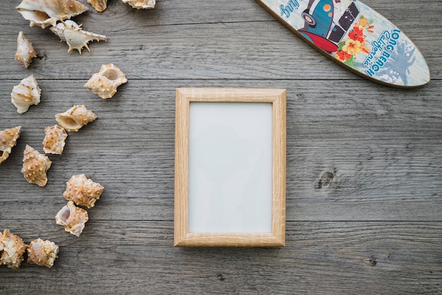 Wooden Surface with Surfboard, Frame, and Seashells