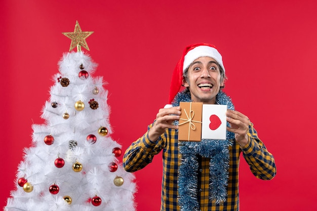 Expressive Young Man Posing for Christmas – Free Download