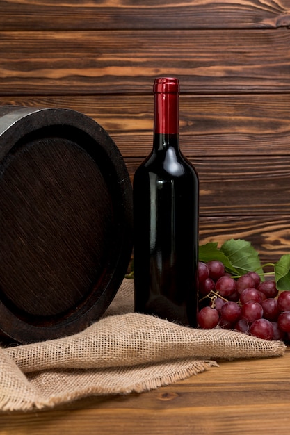 Bottle of wine with barrel