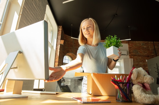 Young Businesswoman Setting Up New Office Space – Free Download