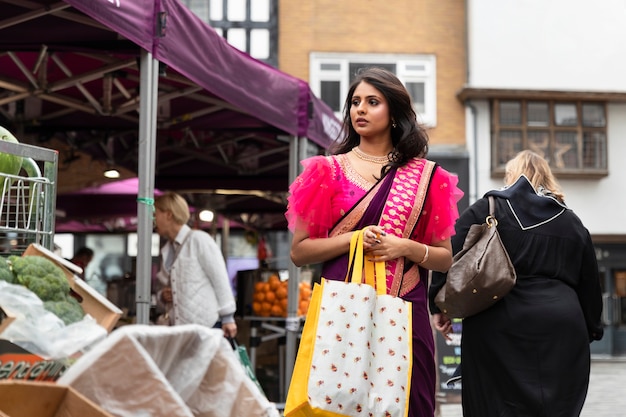 Front view woman carrying shopping bags