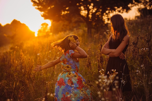 Young Women Pose on the Evening Field