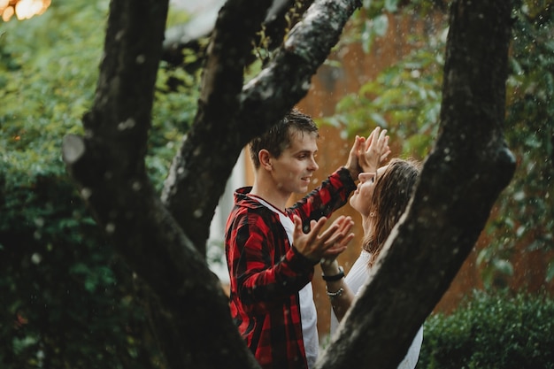 The lovely couple in love embracing in the park