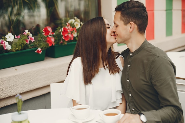 Beautiful couple spend time in a summer city