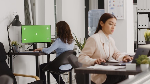 Business Manager Analyzing Greenscreen Display on PC, Checking Isolated Copyspace on Computer in Coworking Space