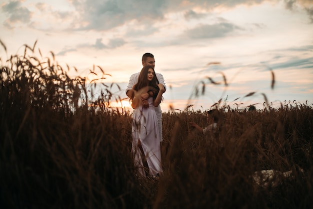 Beautiful couple standing in the field – Free Stock Photo Download