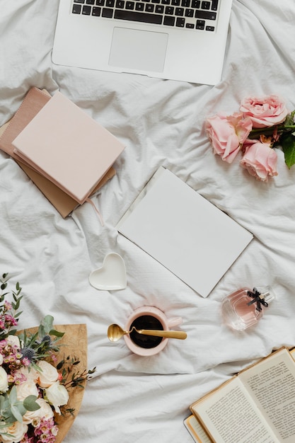 Laptop and notebooks on a girls bed – Free Stock Photo Download