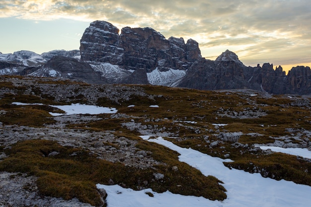 Beautiful Landscape in the Italian Alps under the Cloudy Sky during the Sunset