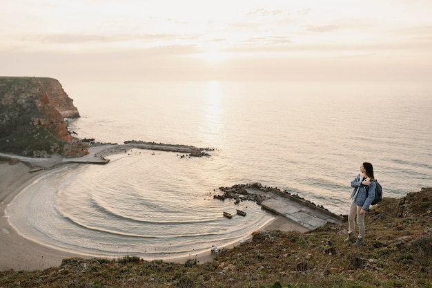 Long shot of woman enjoying the peace around her