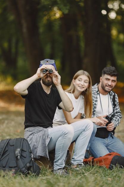 Group of smiling friends in a forest