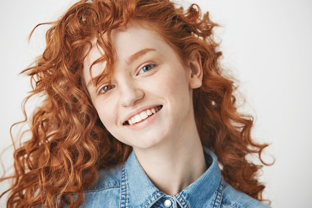 Portrait of ginger cheerful girl smiling