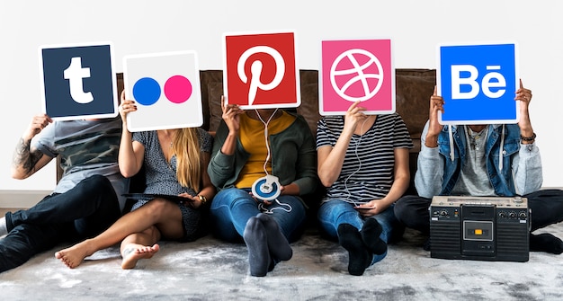 People holding icons of digital brands