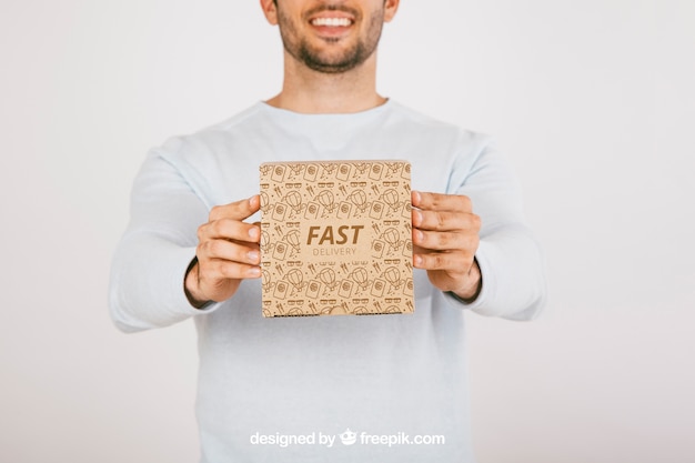 Smiley Man with Carton Box Free Stock Photo