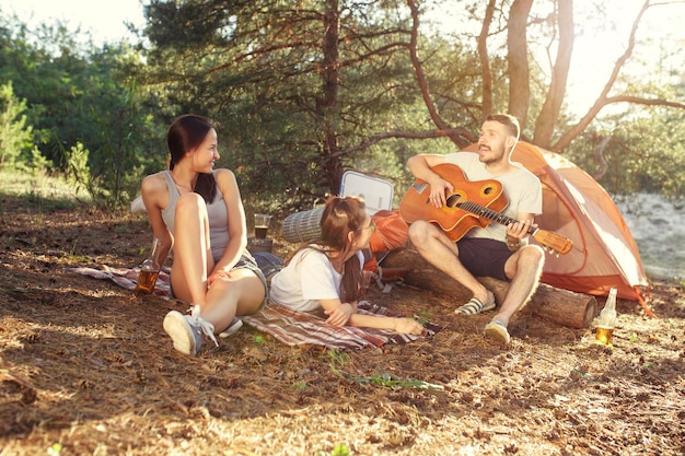 Men and Women Group Camping Party in Forest