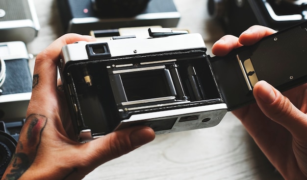 Hands Holding an Open Camera – Free Stock Photo for Download