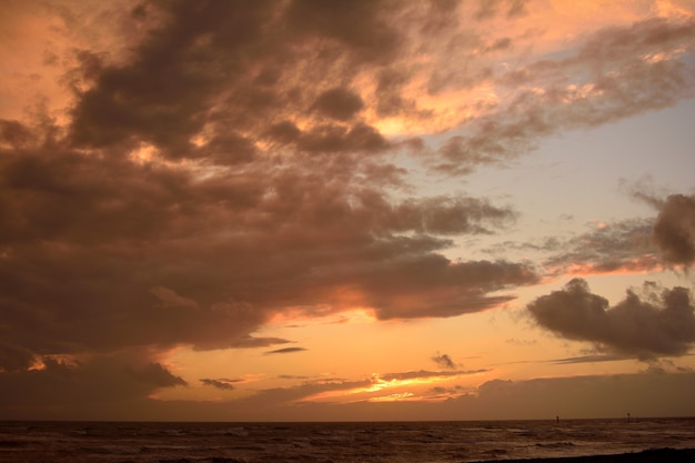 Beautiful Cloudy Sky During Sunset Over the Ocean