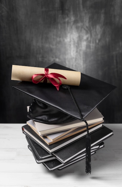 Stack of Books with Graduation Diploma