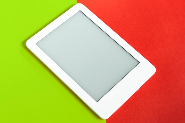 Ebook reader over yellow and red background – Free Stock Photo Download