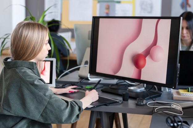 Young woman working in an animation studio