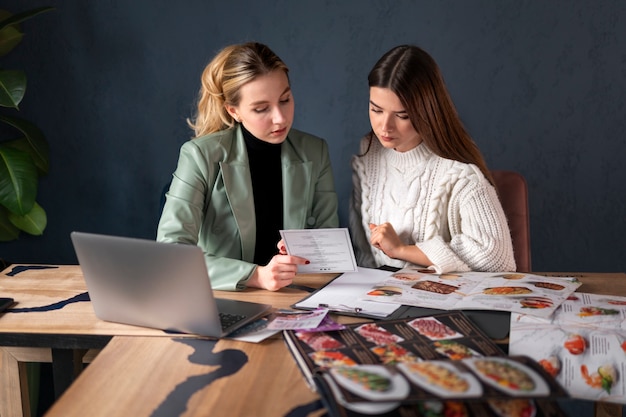 Female wedding planner working with client