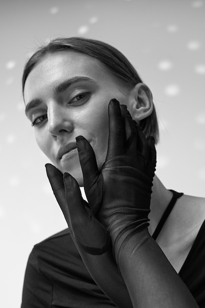 Woman Posing with Black and White Gloves Free Stock Photo