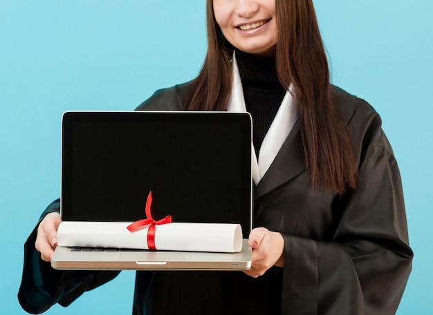 Close-up girl holding laptop