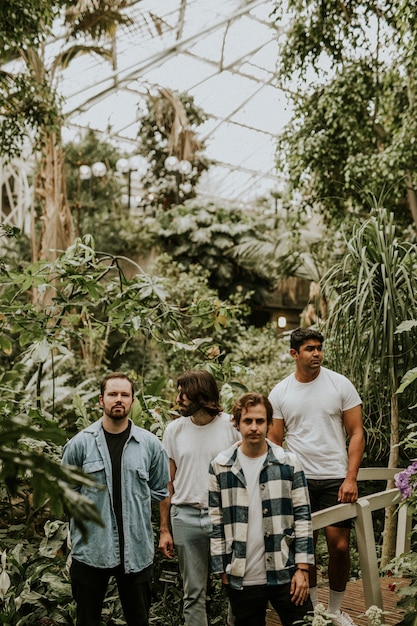 Men posing in garden, botanical greenhouse photoshoot