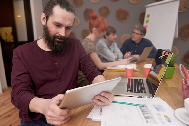 Group of creative people analyzing the result of work