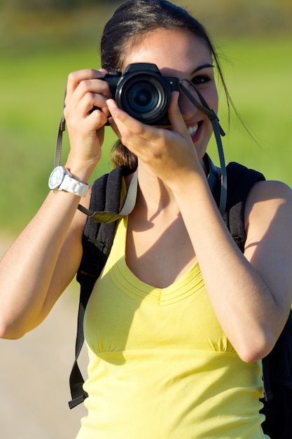 Happy Young Girl Taking Photos in the Field