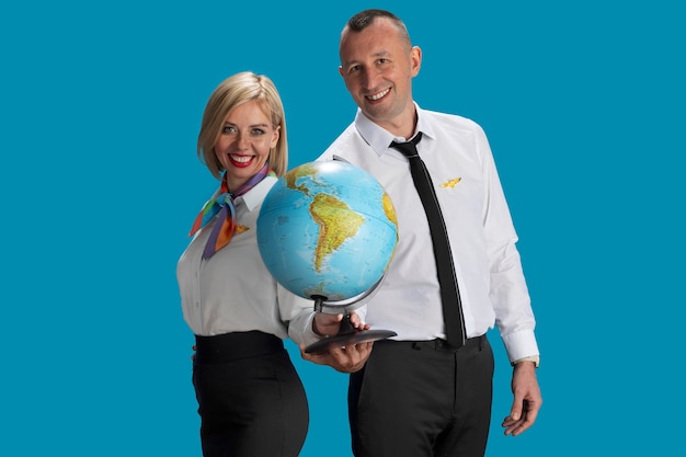 Medium Shot of Flight Attendants with Globe – Free Stock Photo Download