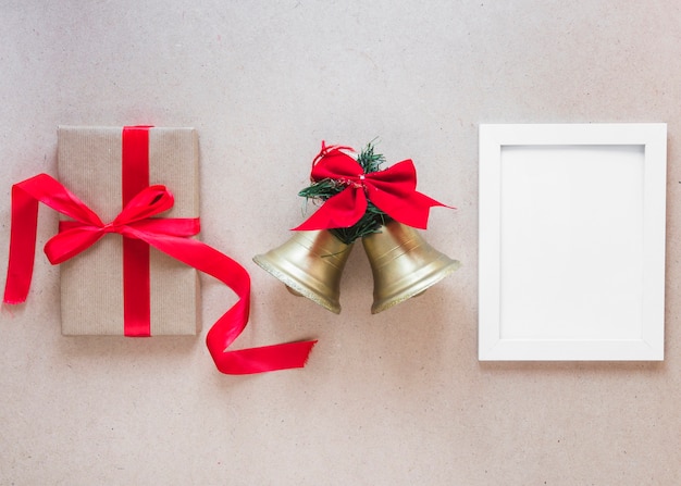 Photo frame with Christmas bells and gift box