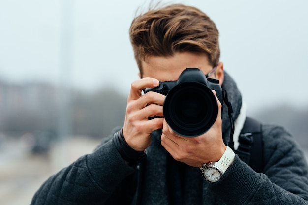 Close up View of Professional Photographer Taking Photos Outdoors