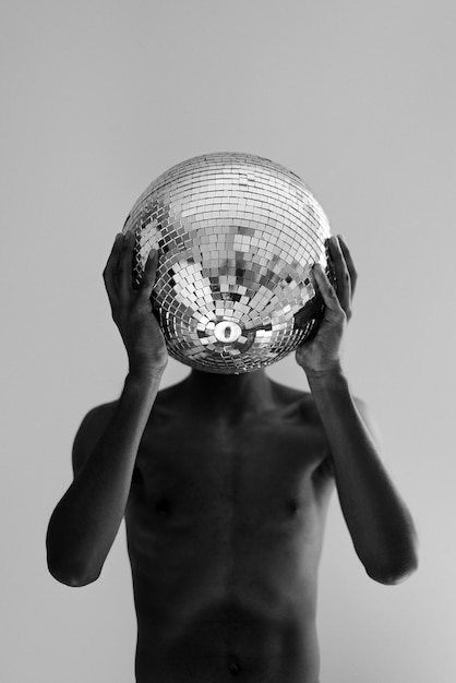 Medium Shot Man Holding Disco Ball