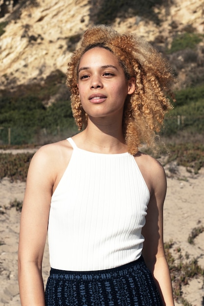 Confident woman in white sleeveless top posing – Free Stock Photo