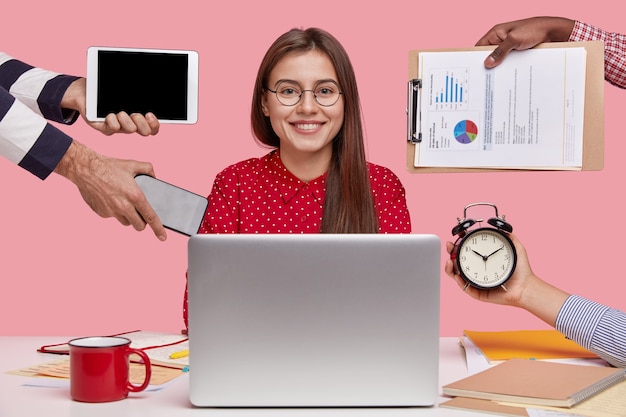 Smiling Woman in Red Shirt Working on Laptop: Free Stock Photo Download