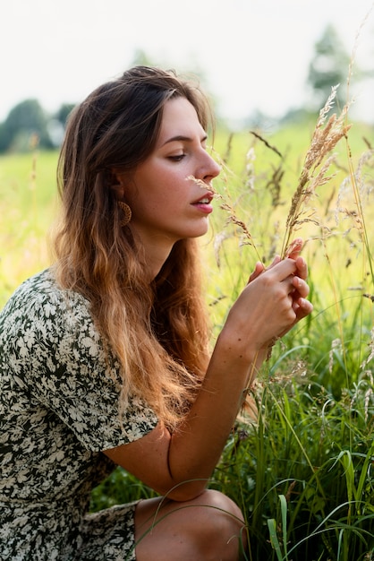 Woman posing in nature side view