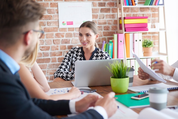 Close up of people working in office