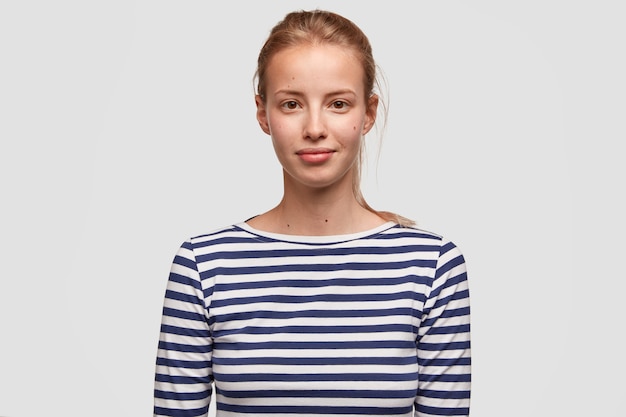 Portrait of young woman wearing striped blouse