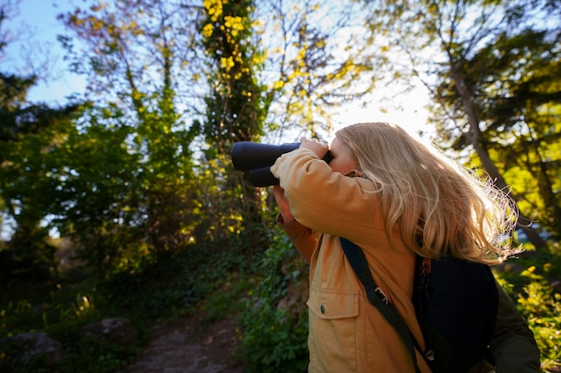 Medium shot girl exploring nature – Free Stock Photo Download